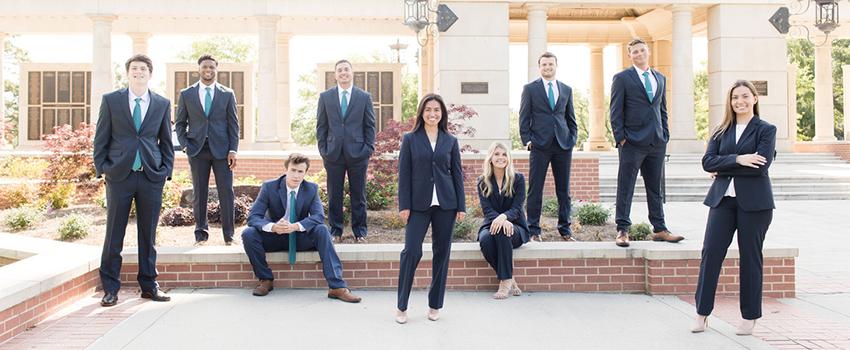 MCOB Scholars standing at Moulton Tower.