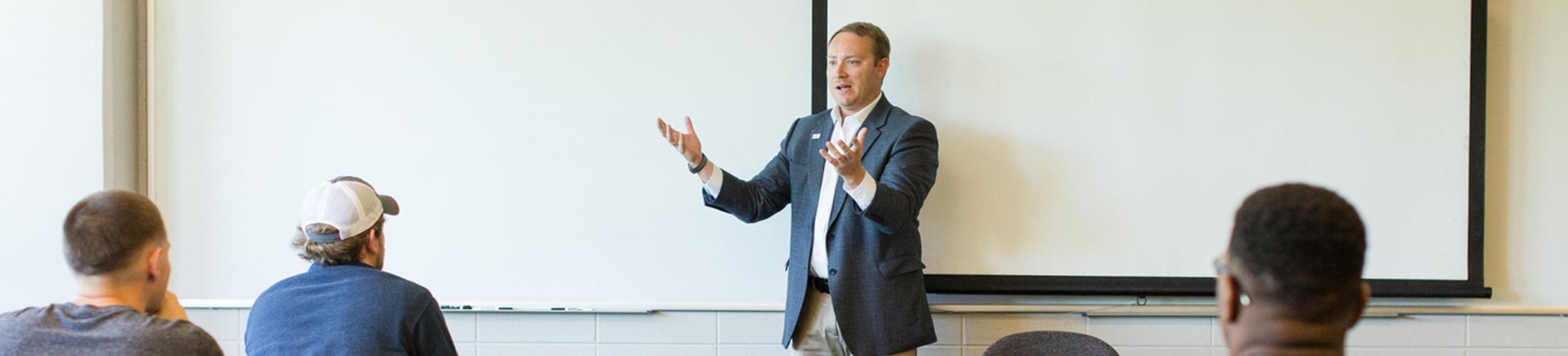 Professor teaching in front of class