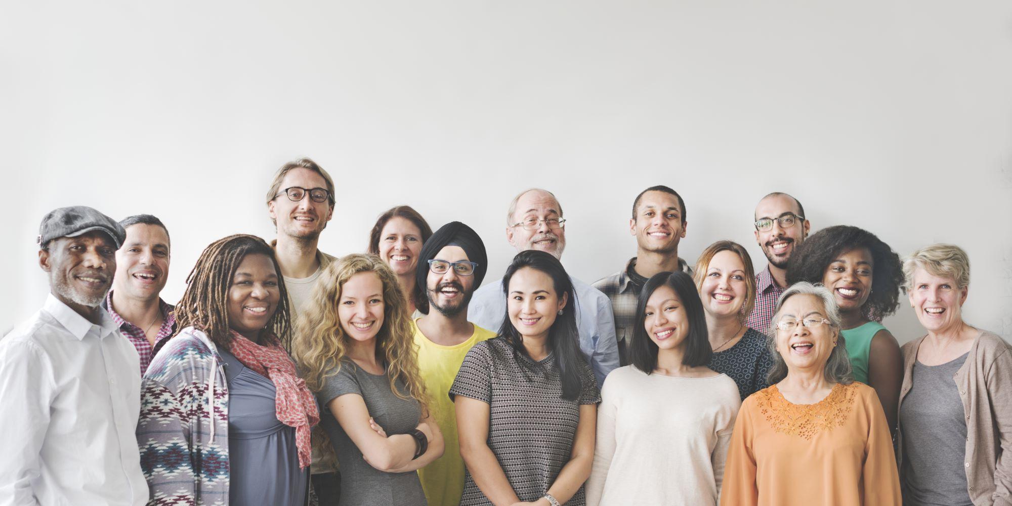 group of people standing together looking at the camera